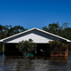 Houses are surrounded by flood waters after Hurricane Delta passed through the area on Oct. 10, 2020 near Lake Charles, Louisiana.